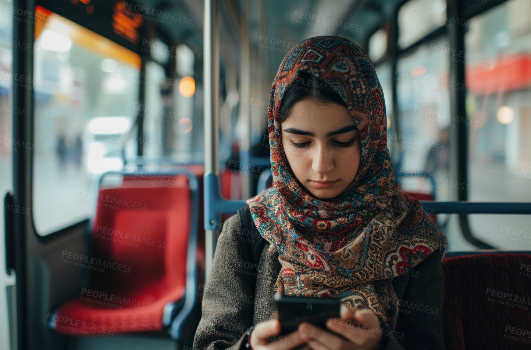 Buy stock photo Muslim woman, smartphone and morning bus ride to the office for public transport, wifi connection and typing message. Single female, employee and student in city transportation for travel and explore