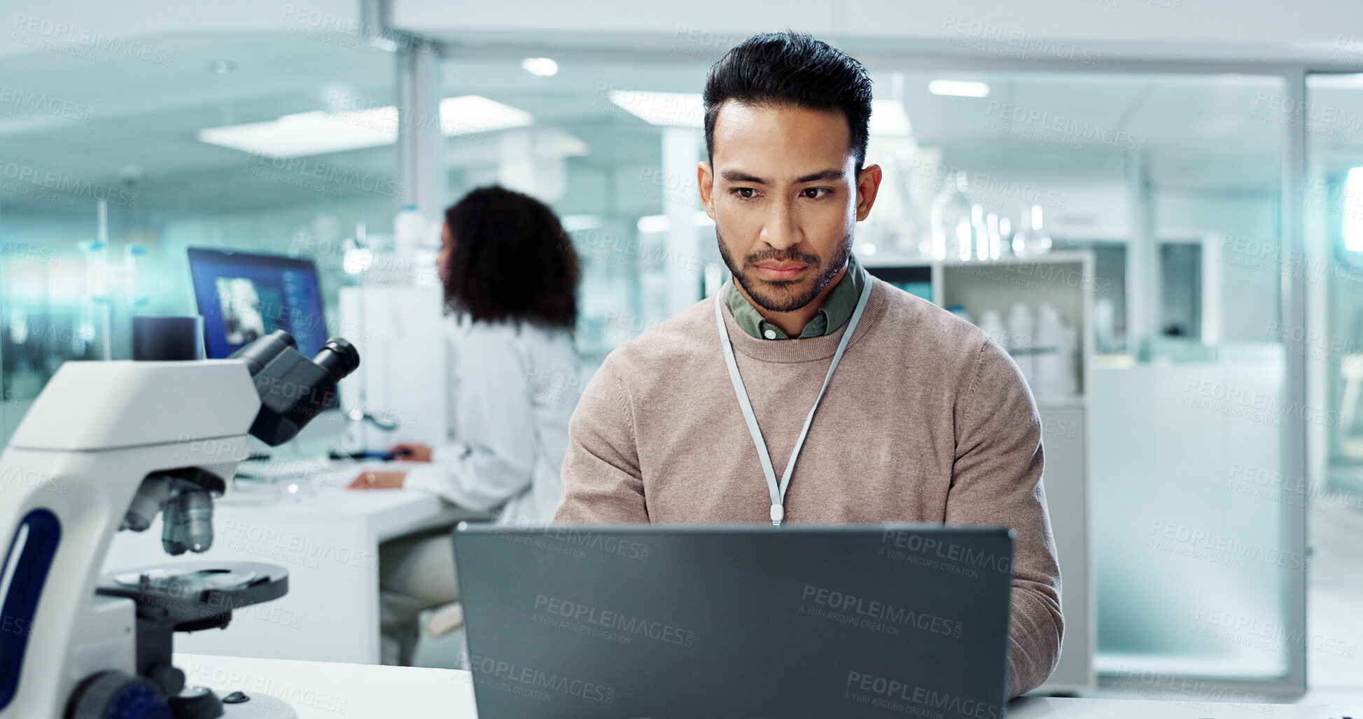 Buy stock photo Man, laptop and lab for futuristic medicine or science or online internet for research, microscope or study. Male person, innovation and biotechnology project for investigation, cure or development