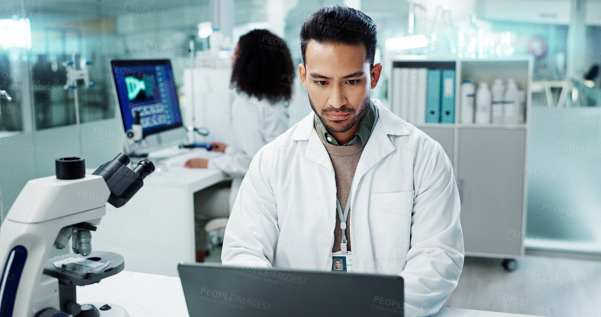 Buy stock photo Scientist, man and reading computer for laboratory test, typing report or medical results of DNA at night. Asian expert thinking on computer for science research, biotechnology and molecule analysis