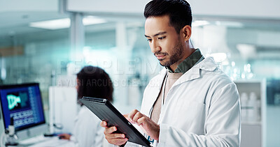 Scientist, man and tablet for laboratory research, DNA analysis and results in medical study at night. Young science expert or people in biotechnology, digital software or computer for test checklist