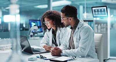Science, teamwork and scientist with laptop in laboratory for communication, pharmaceutical review or planning. Employees, collaboration and technology for research, discussion and digital analysis