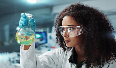 Scientist, research or woman with liquid in test tube for analysis, medical testing and analytics in lab. Biotechnology, healthcare or science person with medicine, sample and vaccine in glass vial