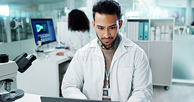Scientist, man and reading computer for laboratory test, typing report or medical results of DNA at night. Asian expert thinking on computer for science research, biotechnology and molecule analysis