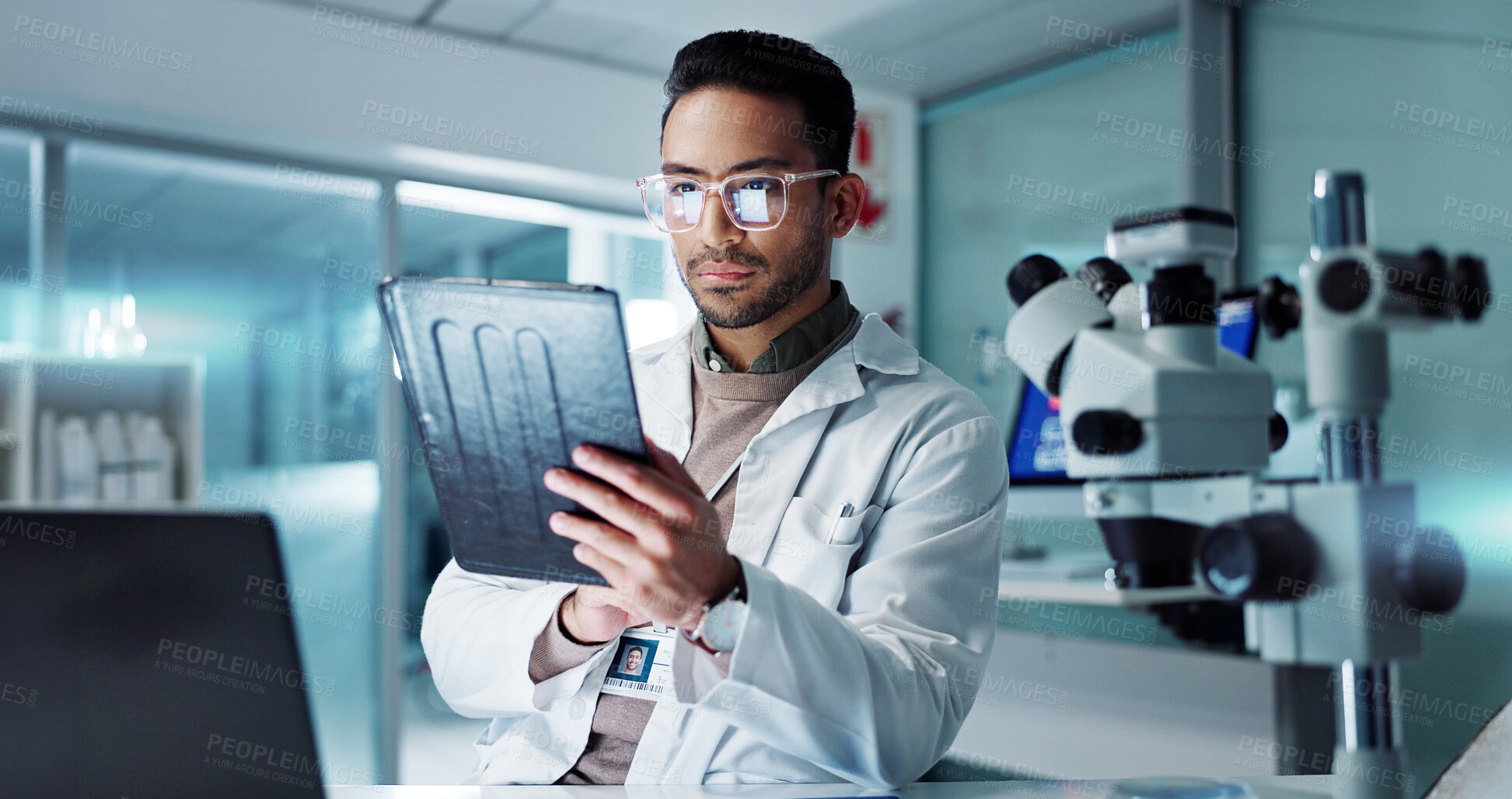 Buy stock photo Tablet, scientist and reading for analysis in laboratory, healthcare and online pharmaceutical research . Asian expert, computer and microscope for medicine and information on innovation cure at work