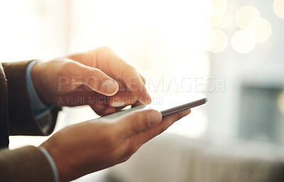 Buy stock photo Cropped shot of an unrecognizable businessman using a mobile phone