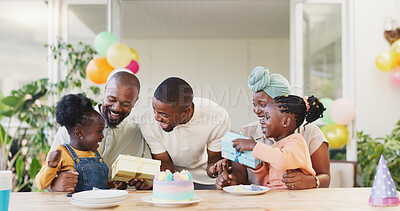 Birthday, present and black family celebrate with children with love, care and surprise. African woman, men and happy kids together at home for a gift, quality time and fun at a party with cake
