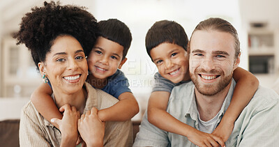 Buy stock photo Love, hugging and face of a family on a sofa for relaxing, bonding and spending time together. Happy, smile and portrait of cute boy children embracing their young interracial parents at modern home.