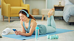 Smartphone, yoga and headphones of woman typing on chat app for fitness communication, social media update or blog writing wellness. Pilates girl with exercise gear and technology in home living room