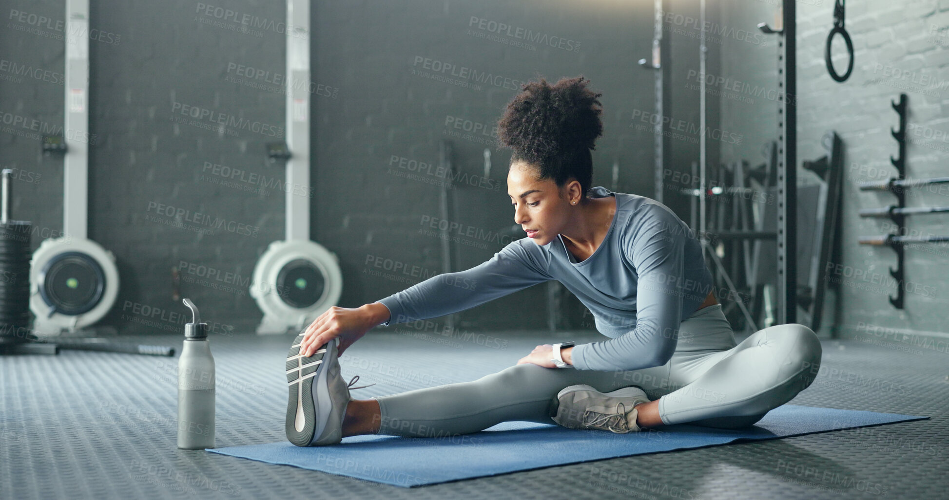 Buy stock photo Black woman, gym and stretching, fitness and exercise motivation and body training for sport and health. Healthy, wellness and preparing for workout, warm up and stretch for active lifestyle.