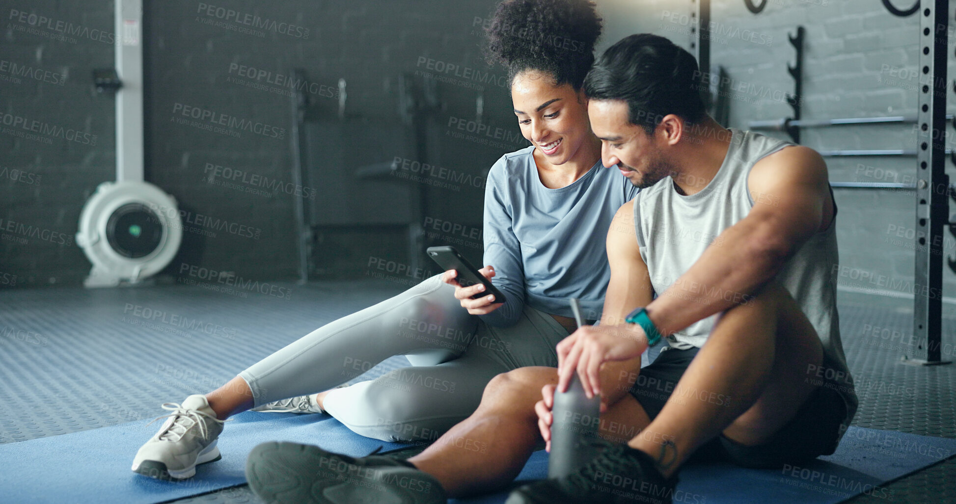 Buy stock photo Smartphone, fitness and personal trainer talking to client for exercise goal planning on mobile app, internet search or health software. Young sports people on floor in conversation and using phone