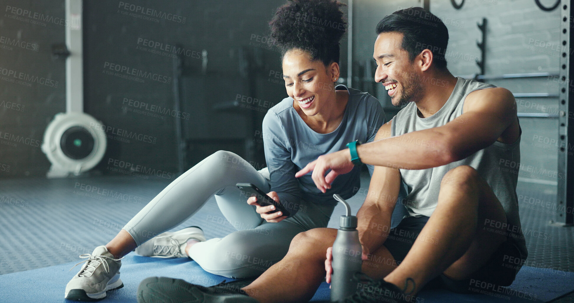 Buy stock photo Smartphone, fitness and personal trainer talking to client for exercise goal planning on mobile app, internet search or health software. Young sports people on floor in conversation and using phone