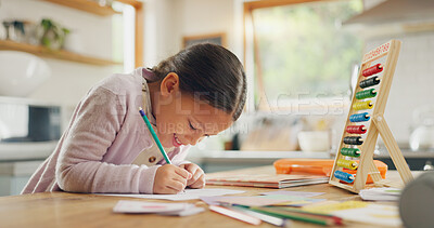 Learning, writing and happy girl child in a kitchen with maths, homework or counting practice in her home. Education, creative and kid student smile while drawing on table for homeschool art lesson