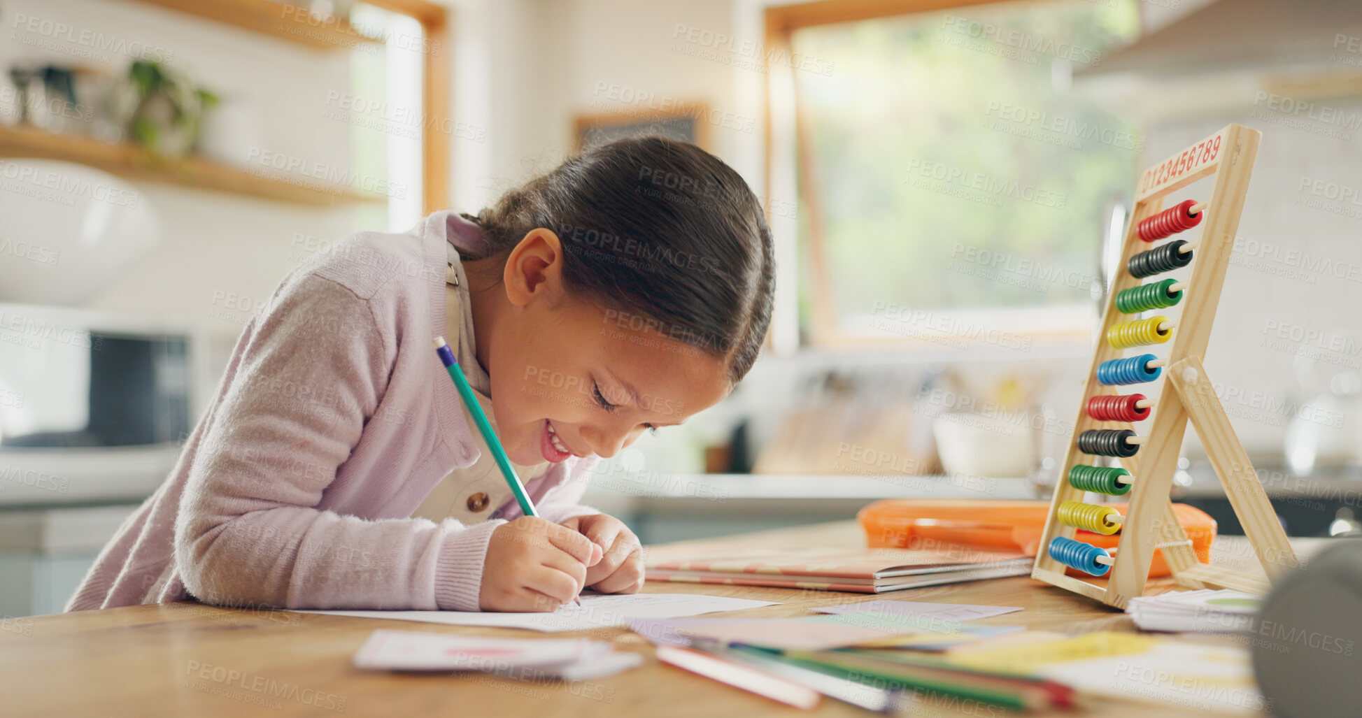 Buy stock photo Learning, writing and happy girl child in a kitchen with maths, homework or counting practice in her home. Education, creative and kid student smile while drawing on table for homeschool art lesson