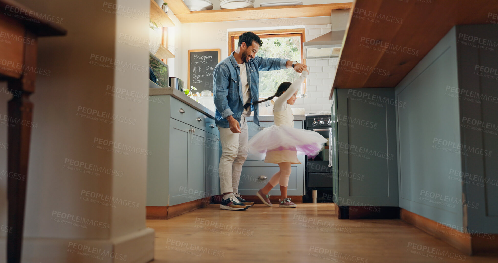 Buy stock photo Support, love and ballet girl bonding with father in a kitchen together, excited and playing as a dancer pr ballerina. Tutu, dad and man dancing with kid with motivation or happiness in house or home