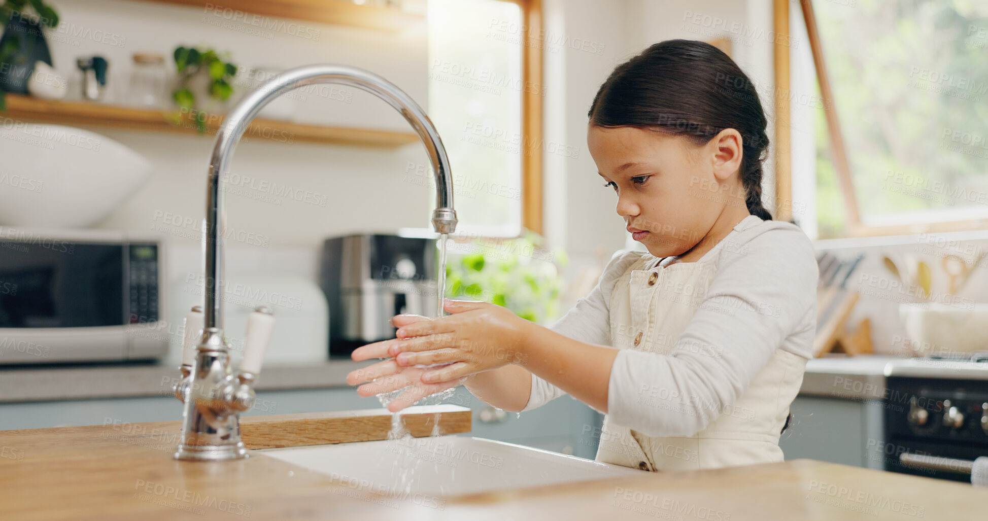 Buy stock photo Water, washing hands and girl child in kitchen for hygiene, safety and responsibility in her home. Splash, cleaning and female kid at a sink for palm scrub, learning and care, bacteria or prevention