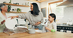 Child cleaning the kitchen with her grandmother and mother while bonding, talking and laughing. Happy, smile and girl kid washing the dishes with her young mom and senior woman in their family home.