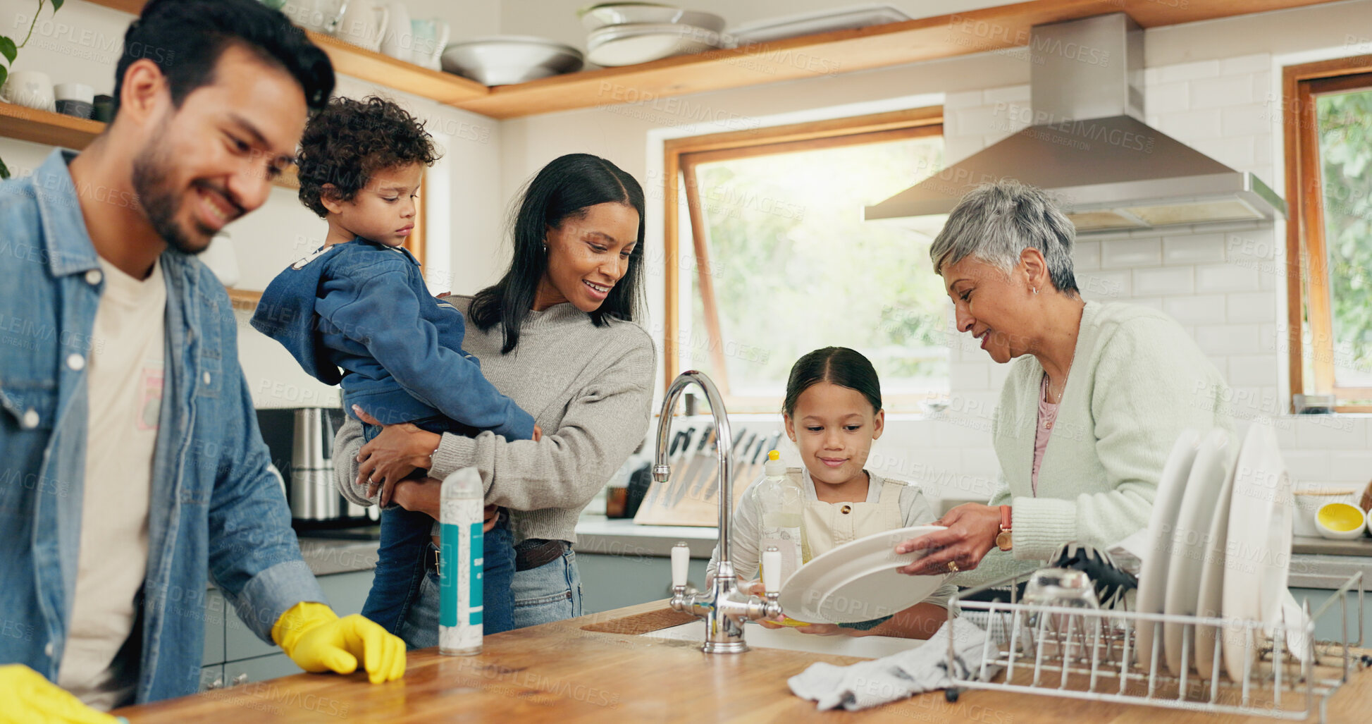 Buy stock photo Cleaning, family and man in a kitchen with cloth for table, hygiene or clean living space after dinner. Washing, dishes and guy parent with household chore for safety from bacteria, dirt or germs