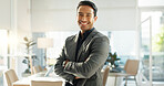 Crossed arms, happy and business Asian man in office for leadership, empowerment and success. Corporate, manager and portrait of person with funny joke in workplace for ambition, pride and confidence