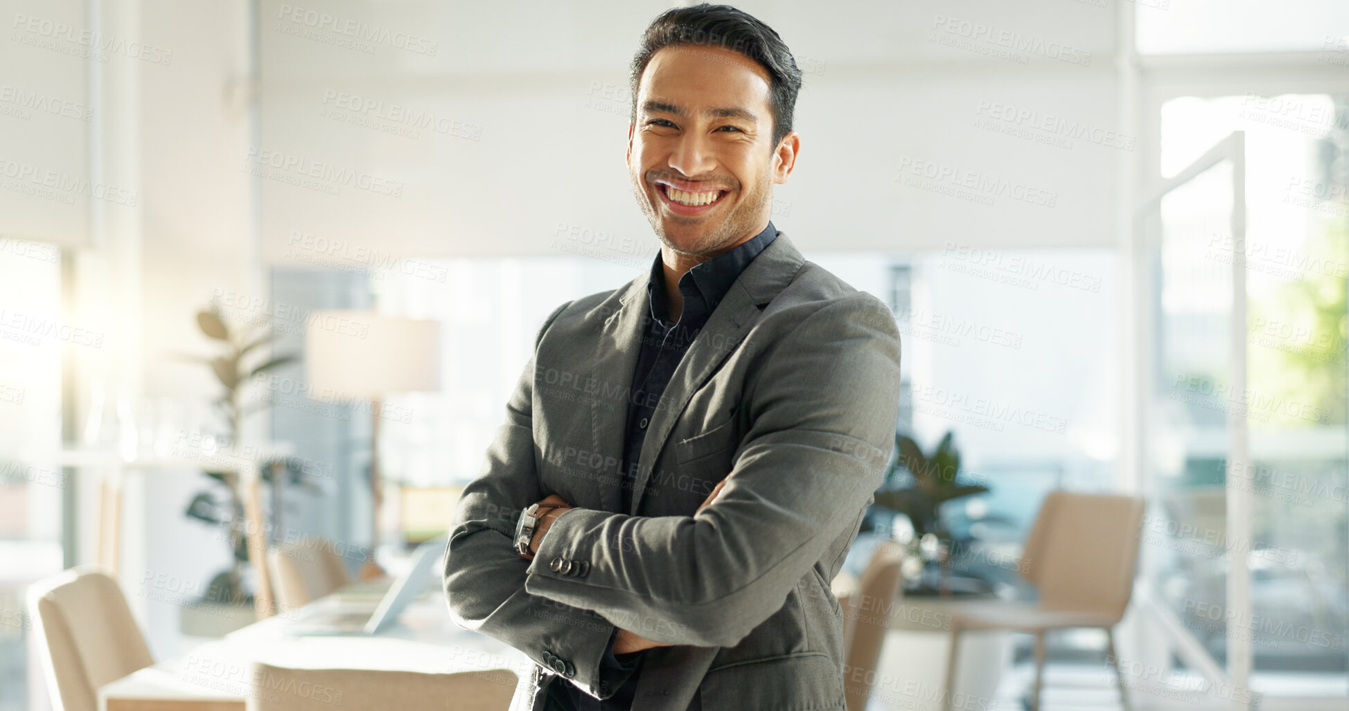 Buy stock photo Crossed arms, happy and business Asian man in office for leadership, empowerment and success. Corporate, manager and portrait of person with funny joke in workplace for ambition, pride and confidence