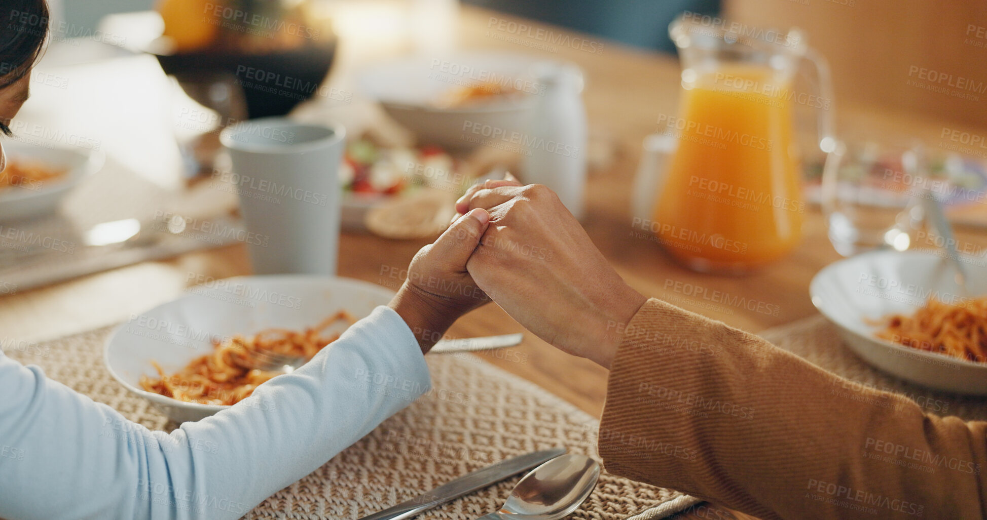 Buy stock photo Hands, food and prayer with family eating together, parents and child with faith, gratitude and God, food and nutrition. Health, wellness and prayer with hungry people at home, worship and trust