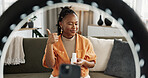 Video, influencer and black woman doing skincare for tutorial on social media or the internet. Dermatology, happy and young African female person filming or live streaming facial routine at home.