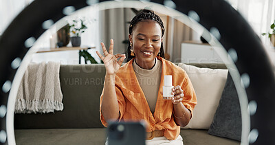 Video, content creator and black woman doing skincare for tutorial on social media or the internet. Dermatology, happy and African female influencer filming or live streaming face routine at home.