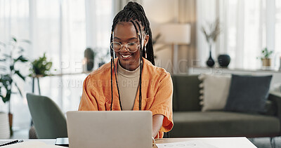 Black woman, typing in home office and laptop for research in remote work, social media or blog in apartment. Freelance girl at desk with computer writing email, website post and online chat in house