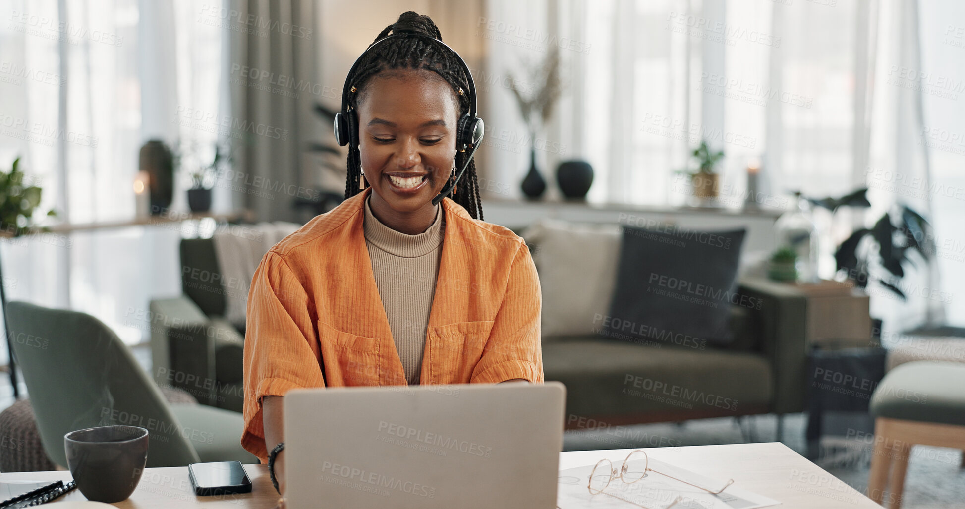 Buy stock photo Black woman, headset with laptop and phone call, virtual assistant or crm in home office. Remote work girl at desk with computer, typing and conversation for advice, online chat and help in apartment