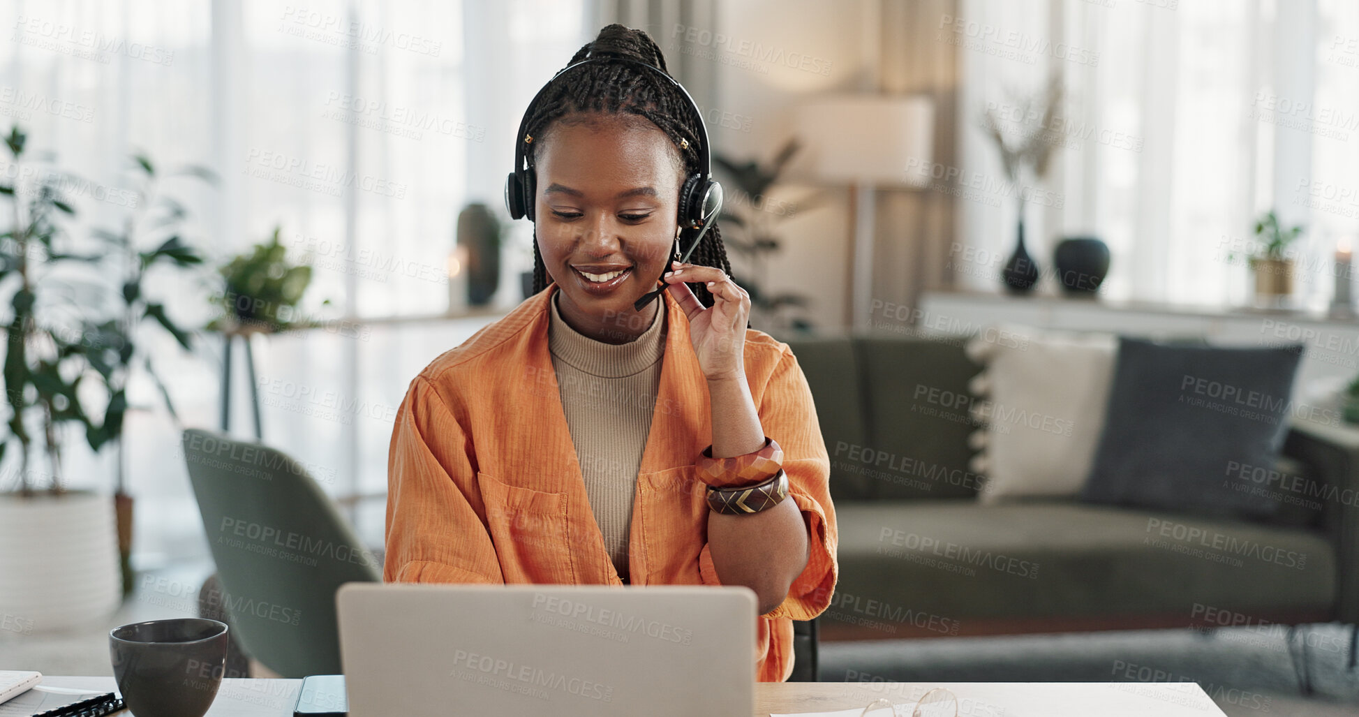 Buy stock photo Black woman, headset in home office with laptop and phone call, remote work and crm in apartment. Virtual assistant at desk with computer, typing and conversation for advice, online chat and support