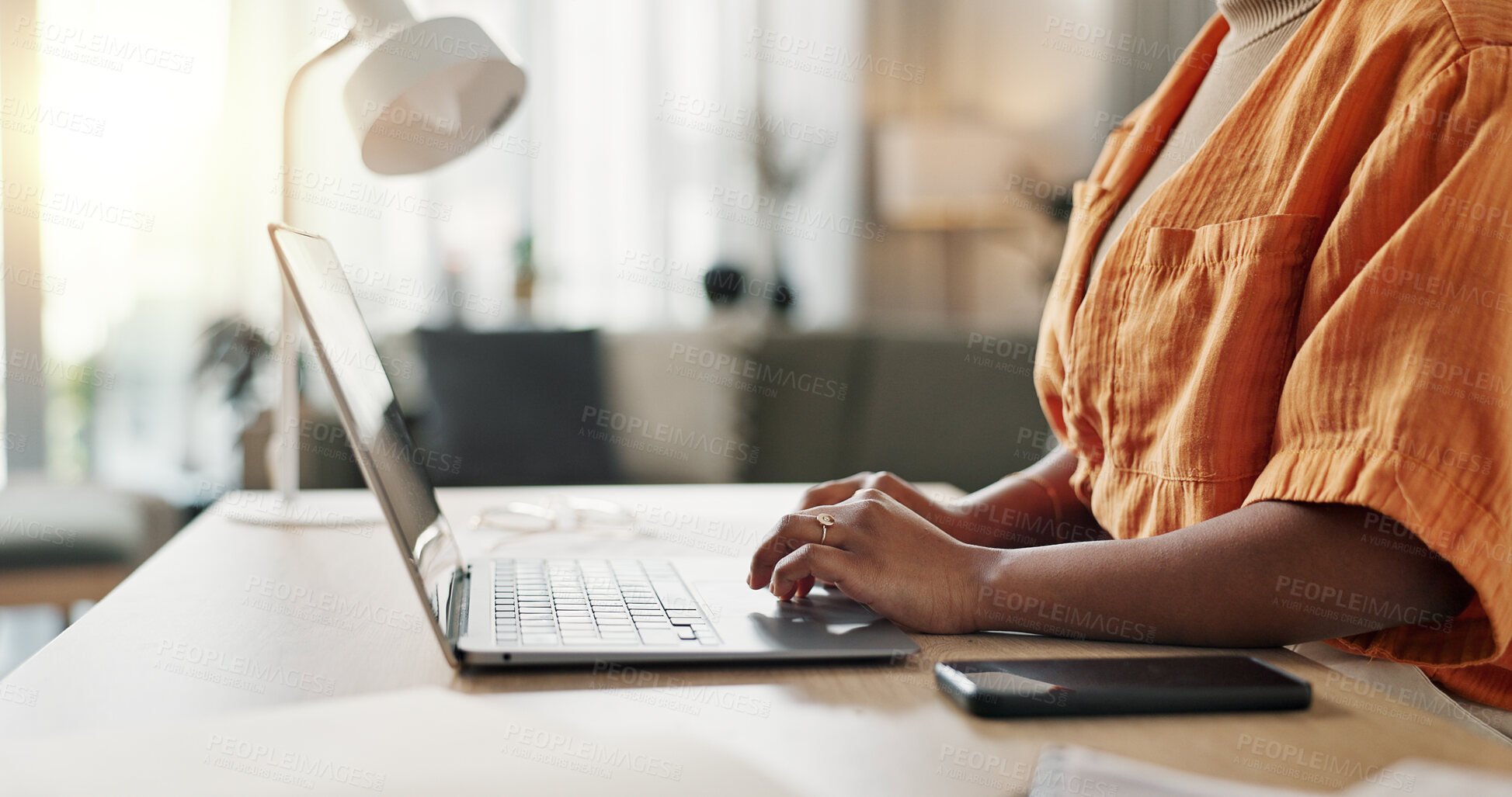 Buy stock photo Hands of woman at desk, typing and laptop for remote work, social media or blog post research with in home office. Freelance girl with computer writing email, website or online chat in apartment.
