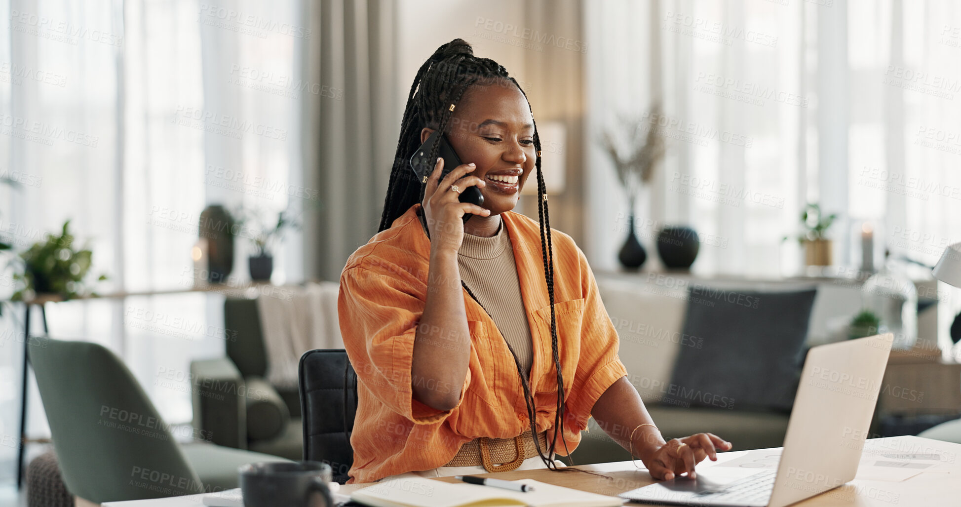 Buy stock photo Black woman in home office, phone call and laptop for remote work, social media or content management. Happy girl at desk with computer, cellphone and online chat in house for freelance networking.