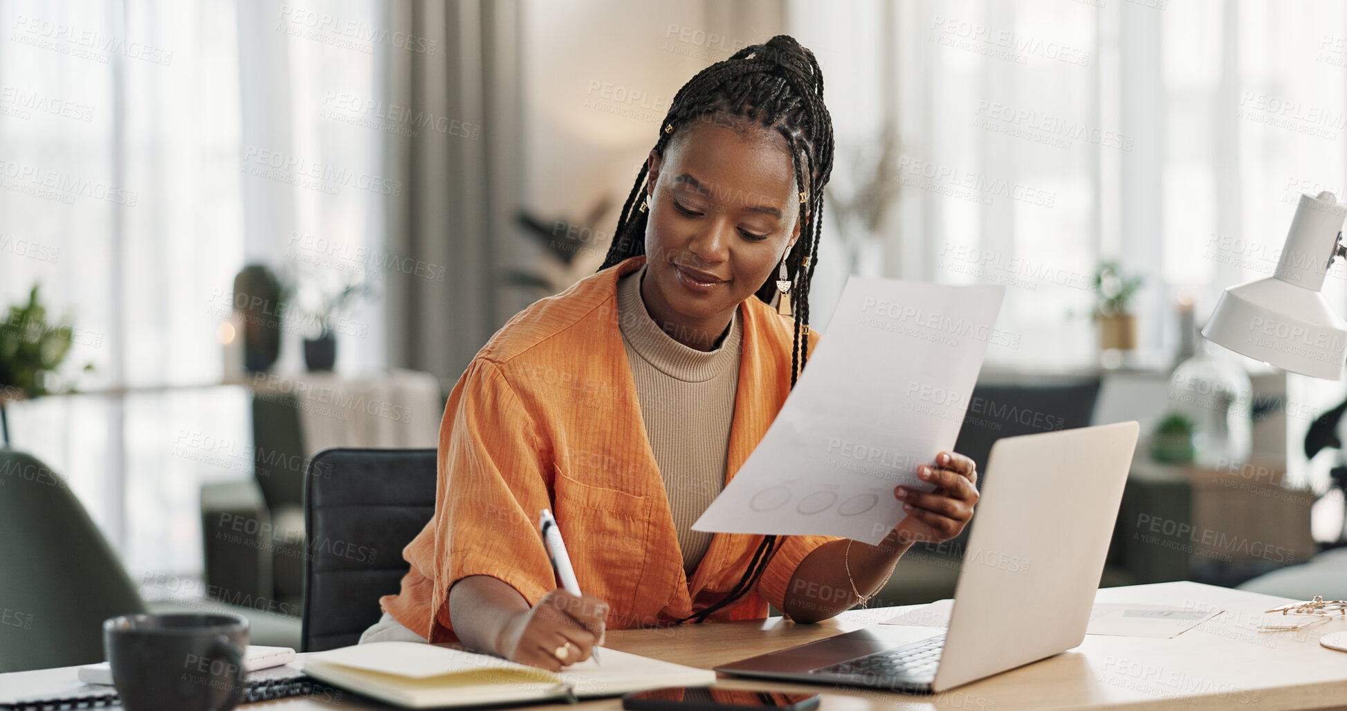 Buy stock photo Black woman in home office, documents and laptop for research in remote work, ideas and thinking. Happy girl at desk with computer, writing notes and online search in house for freelance networking.