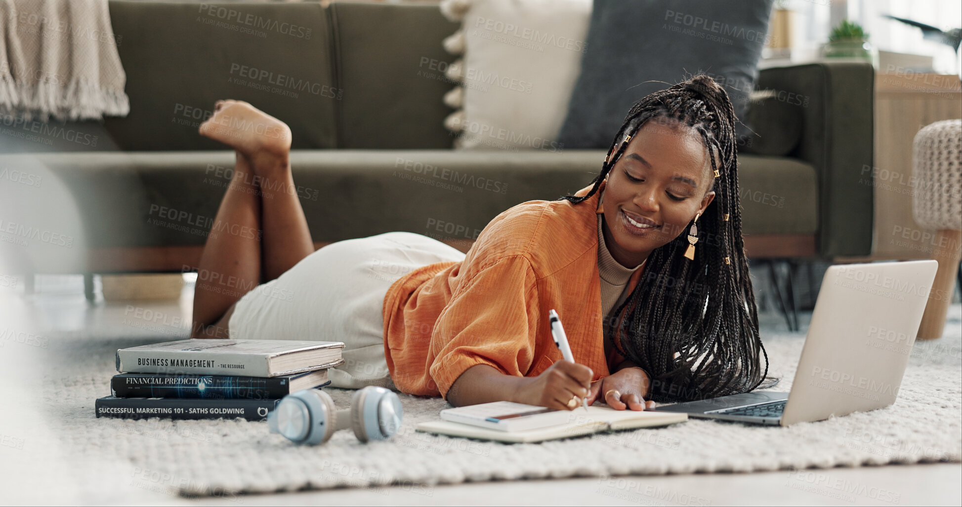 Buy stock photo Laptop, happy and woman writing notes on the floor in the living room of modern apartment. Technology, smile and young African female university student studying on a computer in the lounge at home.