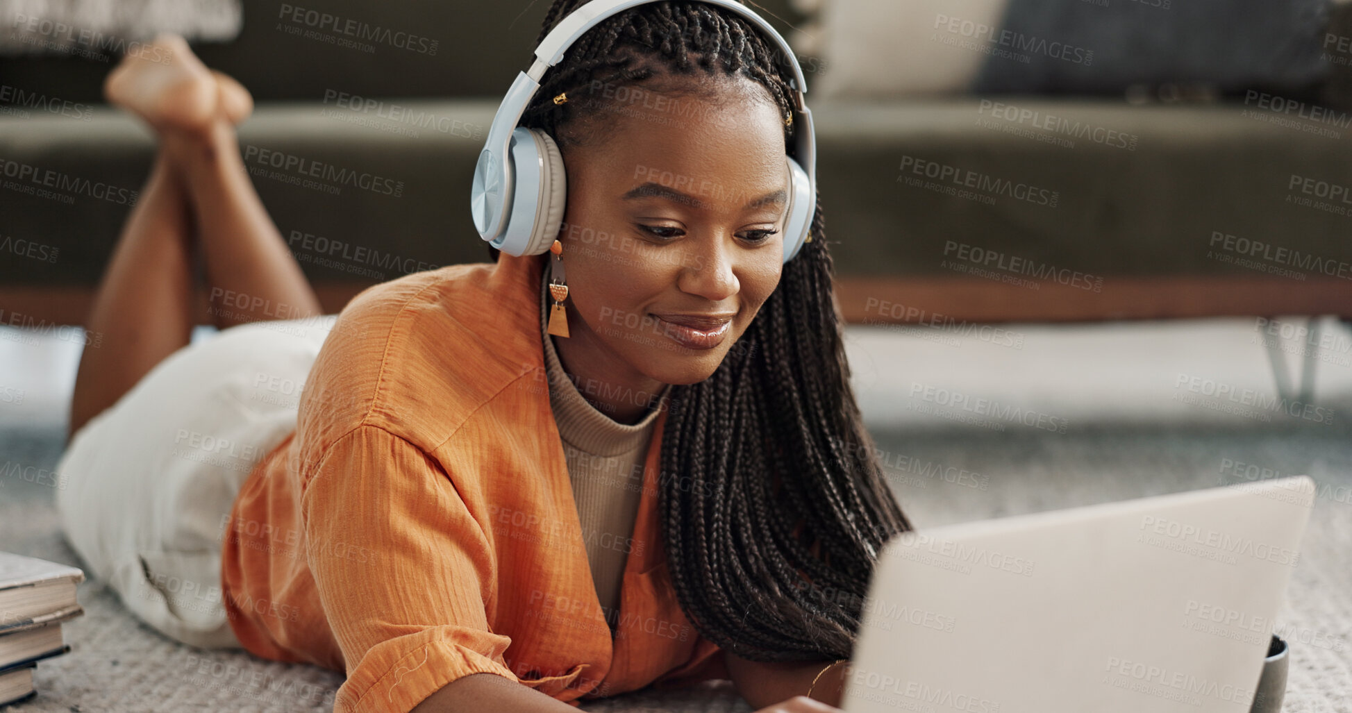 Buy stock photo Home, smile and black woman with a headphones, streaming music or sound in a living room. African person on a sofa, apartment or girl with headset, listening to audio or relax with happiness or song