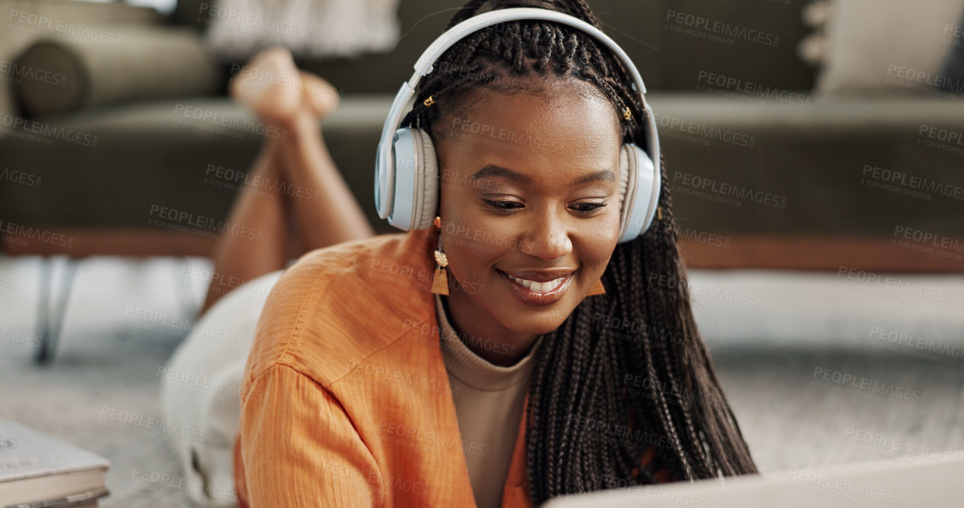 Buy stock photo Home, smile and black woman with a headphones, streaming music or sound in a living room. African person on a sofa, apartment or girl with headset, listening to audio or relax with happiness or song