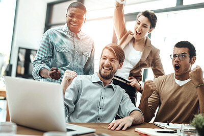 Buy stock photo Shot of a group of businesspeople cheering while working in an office