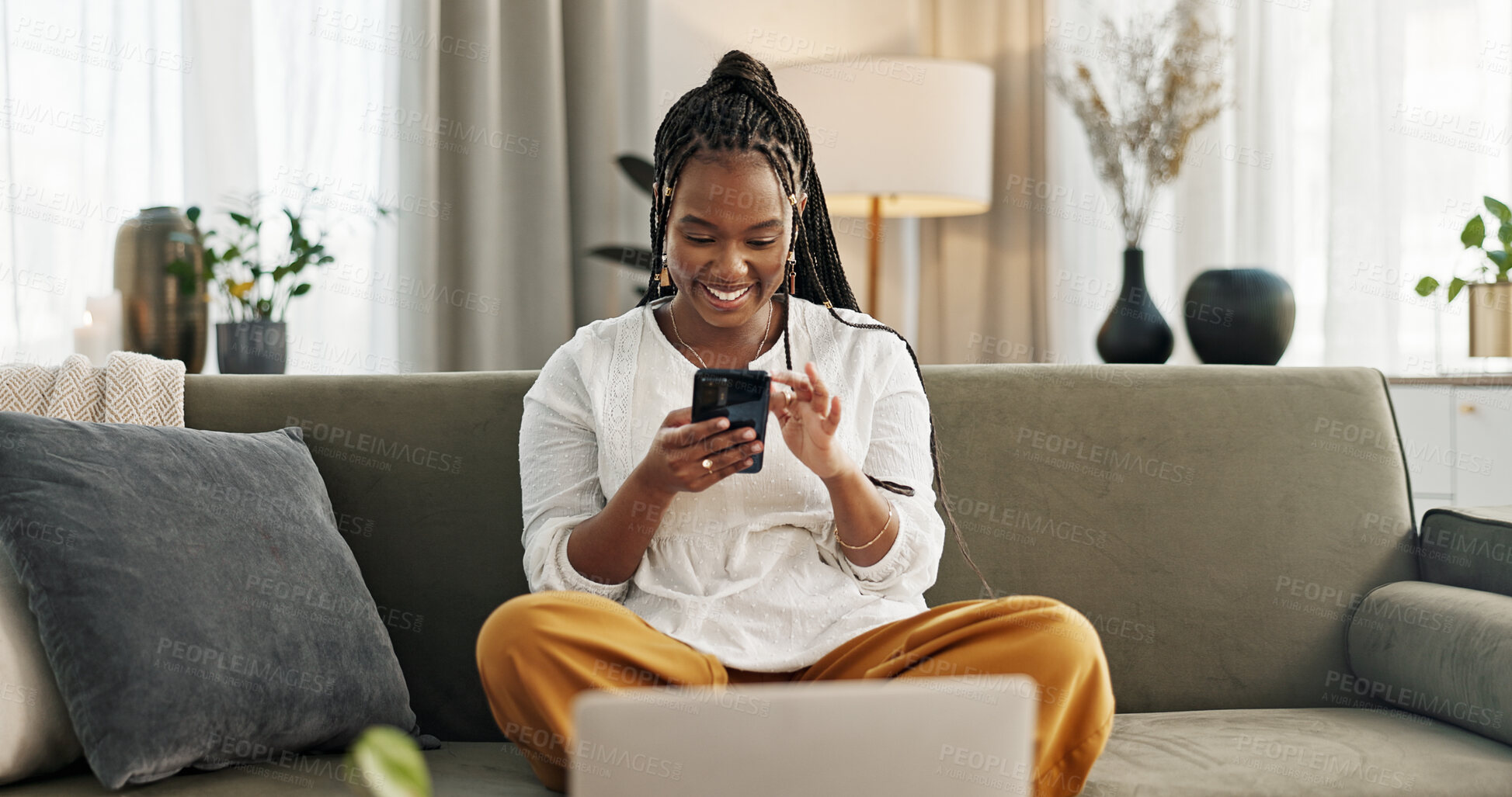 Buy stock photo Home, funny and black woman on a sofa, cellphone and connection with social media, comedy post and laugh. African person, apartment or girl on couch, smartphone or mobile user with humor or typing