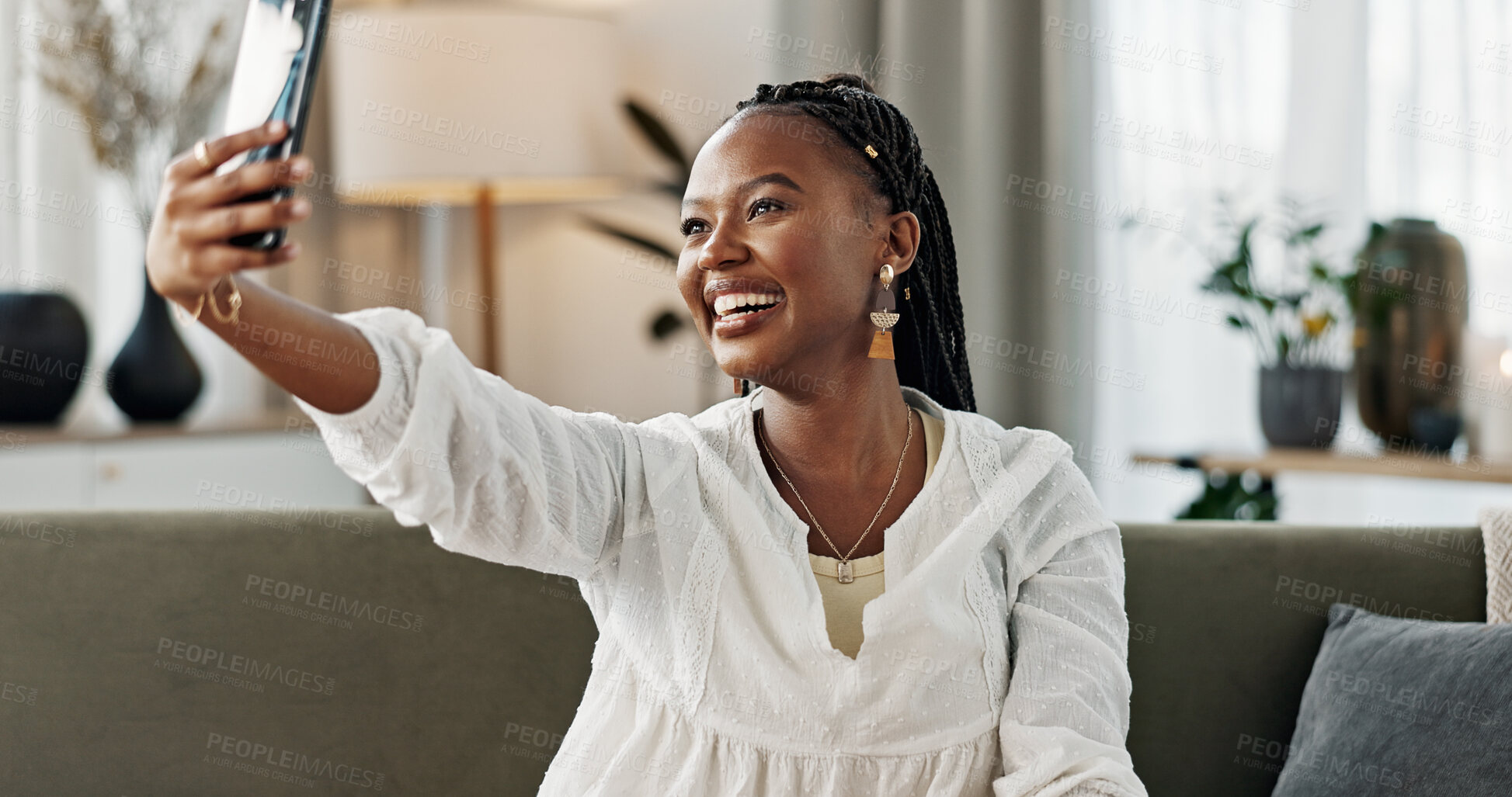 Buy stock photo Smile, selfie and black woman with peace sign, funny face and relax on sofa in living room. V hand, picture and happy African person or influencer at home on couch on social media with tongue out