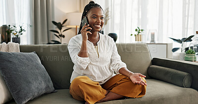 Funny, phone call and black woman on sofa, talking or communication at home. Smartphone, conversation and African person laughing, listening to story and comedy, chat or news and happy in living room