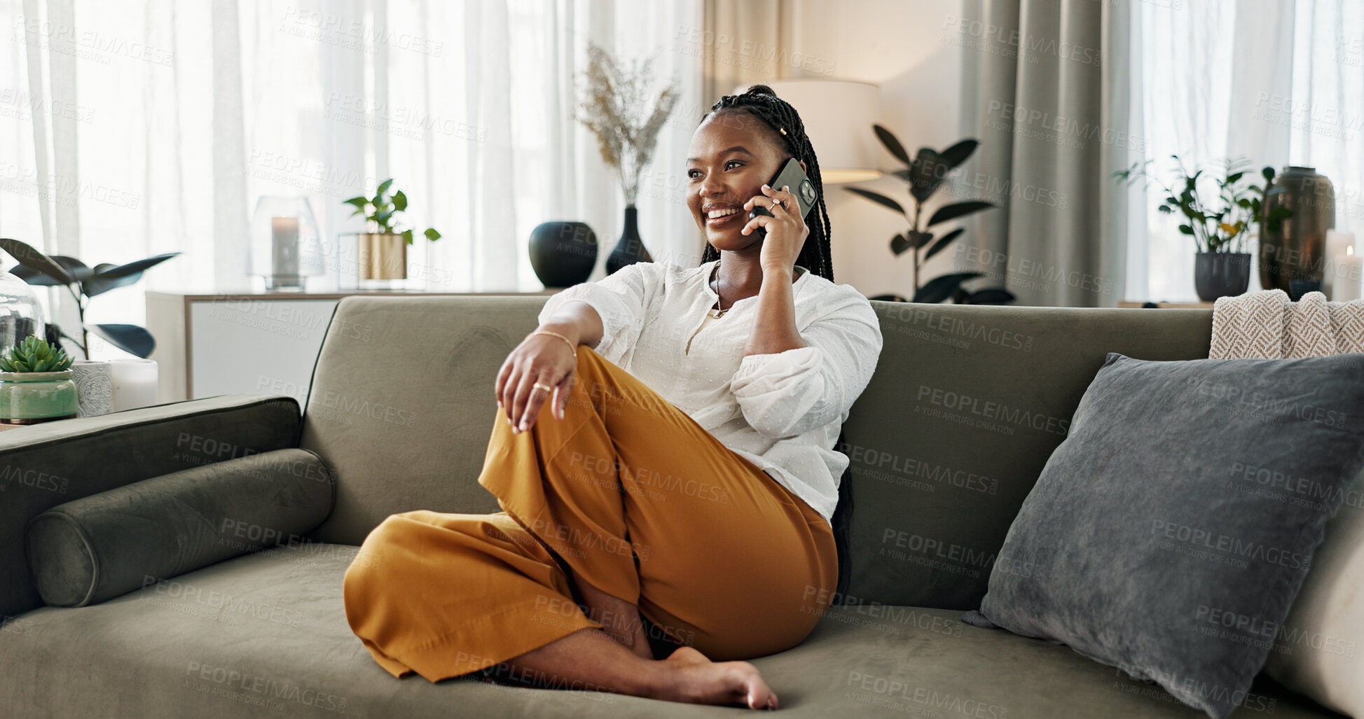 Buy stock photo Black woman on sofa, relax and phone call for networking, conversation and connection with smile in home. Happy girl on couch with smartphone, funny discussion and online chat in living room of house