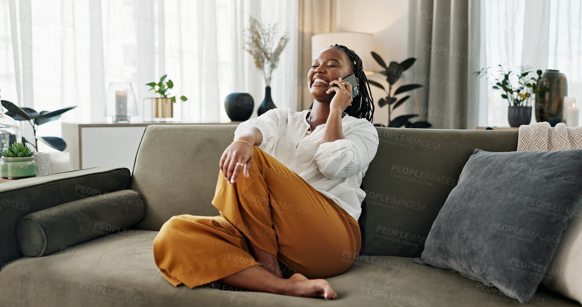 Buy stock photo Funny, phone call and black woman in home, talking or communication on sofa. Smartphone, conversation and African person laughing, listening to story and comedy, chat or news and happy in living room