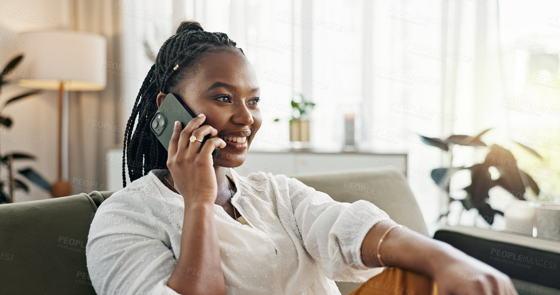 Buy stock photo Funny, phone call and black woman on sofa, conversation or communication at home. Smartphone, talking and African person laughing, listening to story and comedy, chat or news and happy in living room