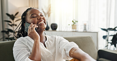 Funny, phone call and black woman on sofa, conversation or communication at home. Smartphone, talking and African person laughing, listening to story and comedy, chat or news and happy in living room