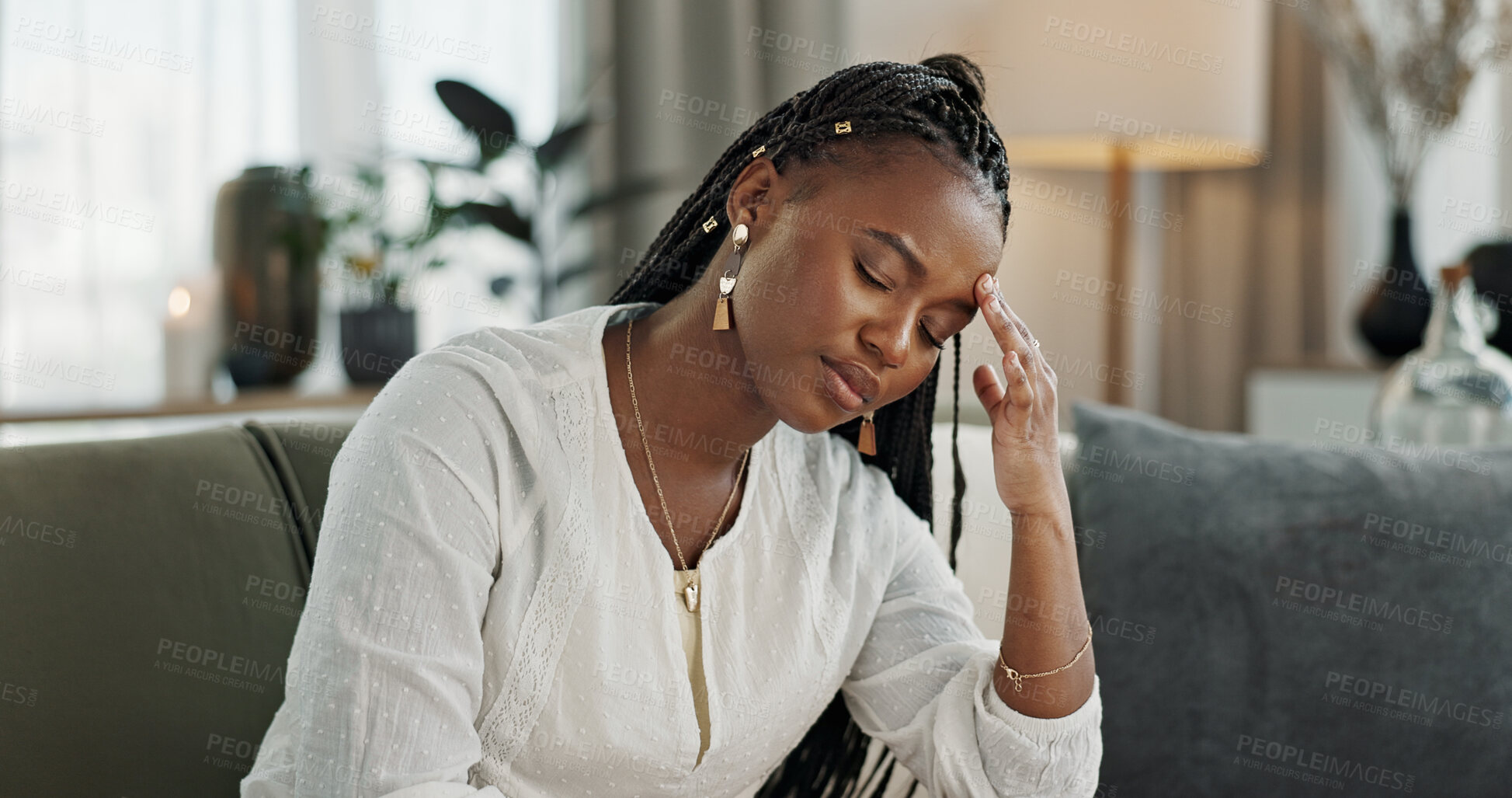 Buy stock photo Headache, burnout and young black woman in the living room of her modern apartment on weekend. Stress, mental health and sick African female person with migraine for illness in lounge at home.