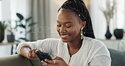 Home, smile and black woman on a couch, smartphone and connection with social media, post and typing. African person, apartment or girl on sofa, cellphone or mobile user with internet and network