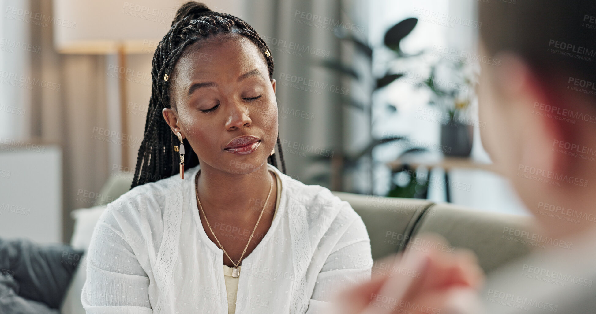 Buy stock photo Psychology, mental health and empathy with a black woman therapist talking to a patient in her office. Support, consulting and trauma with a young psychologist listening to a client in grief therapy