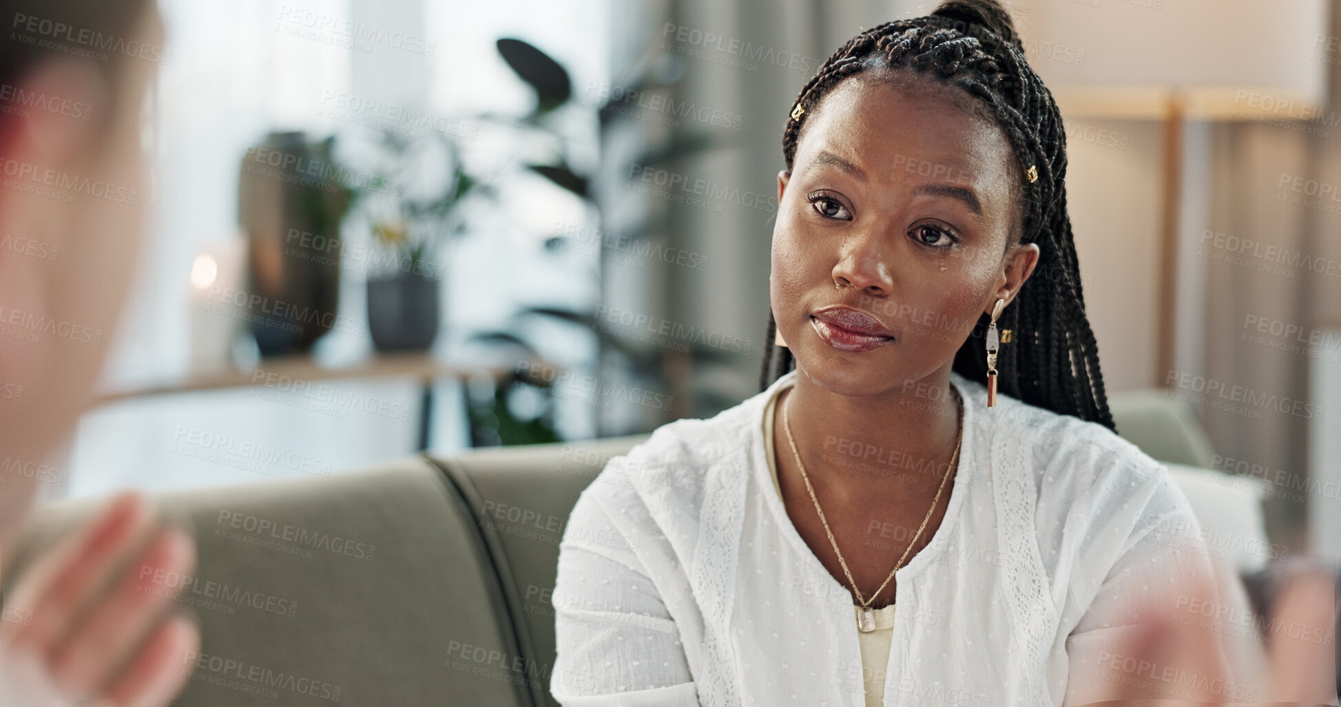 Buy stock photo Psychology, mental health and empathy with a black woman therapist talking to a patient in her office. Support, consulting and trauma with a young psychologist listening to a client in grief therapy