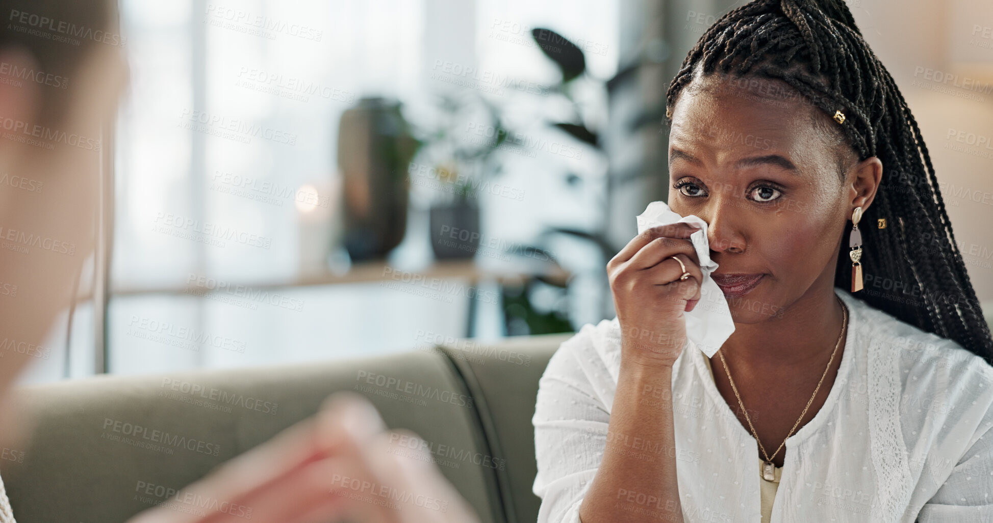 Buy stock photo Psychology, mental health and support with a black woman therapist talking to a patient in her office. Consulting, empathy and trauma with a young psychologist listening to a client in grief therapy