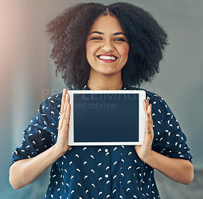 Buy stock photo Studio shot of a young woman holding up a digital tablet with a blank screen against a gray background