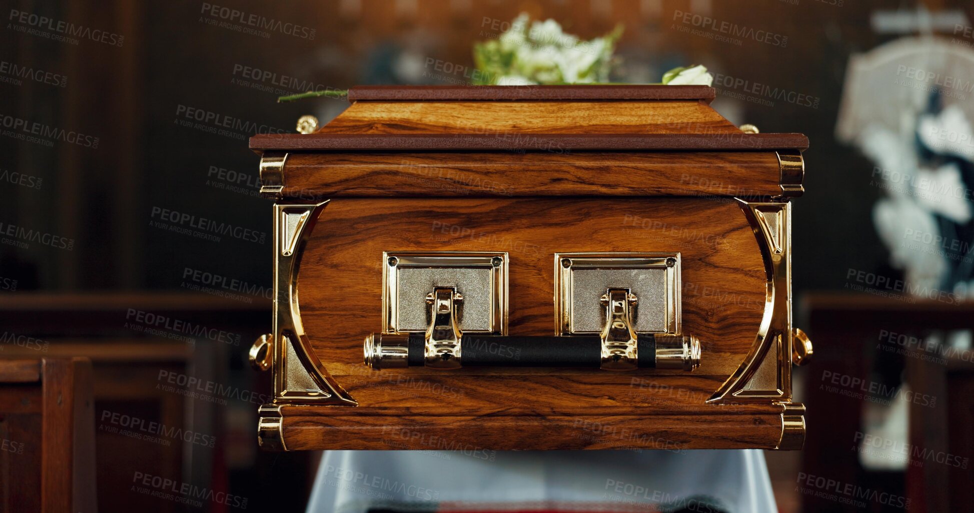 Buy stock photo Coffin, funeral and death in church for service, closeup or zoom of event for respect and honor with faith. Memorial, Catholic religion and burial in chapel, casket for farewell and place of worship